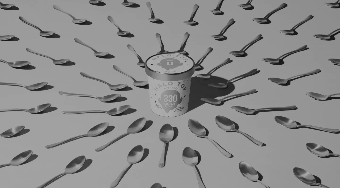 Carousel Background.webp Halo Top Pint surrounded by spoons.