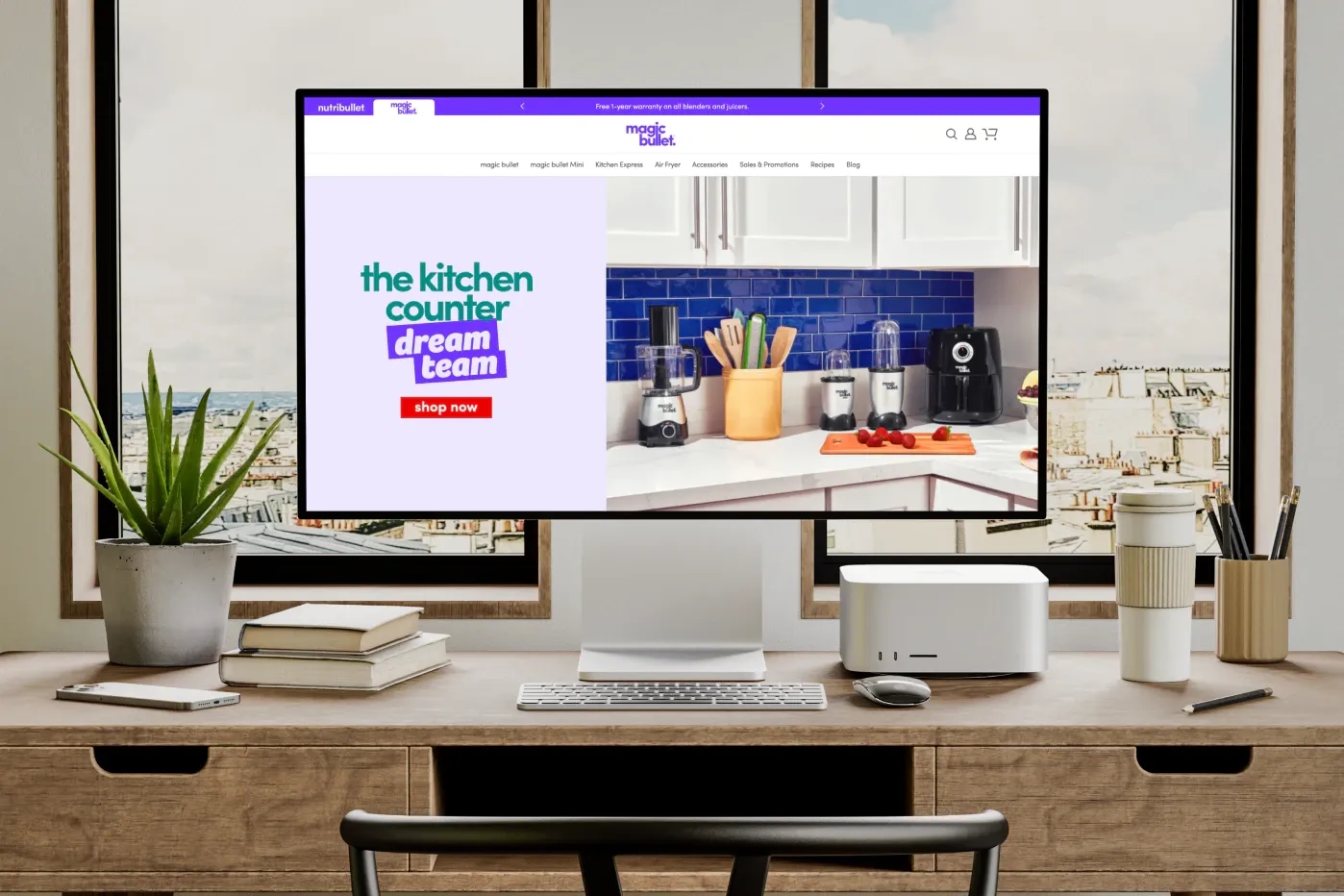 nb-stacked-a.webp Image of a large monitor in an office with the magic bullet Homepage.