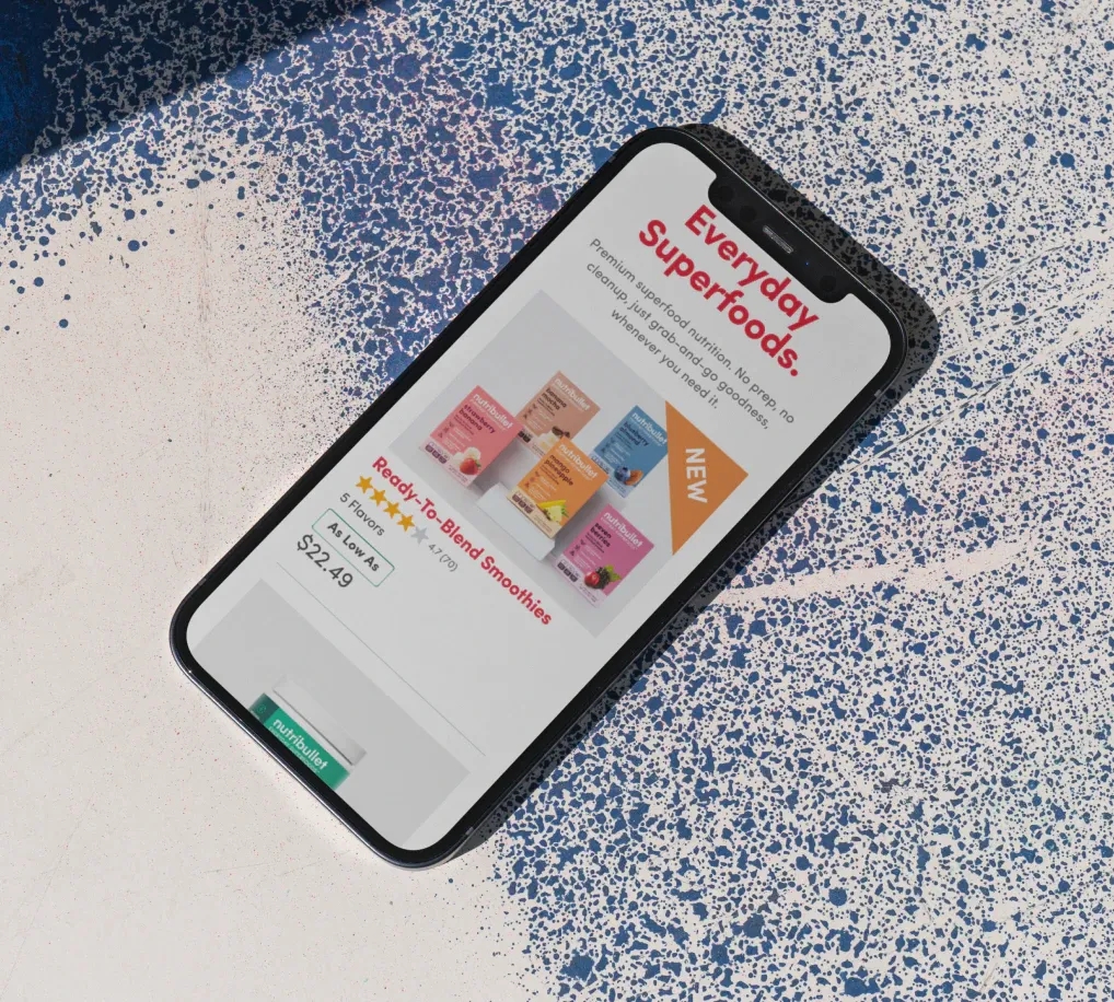 nb-stacked-b.webp Image of an iPhone with the nutribullet supplement website.