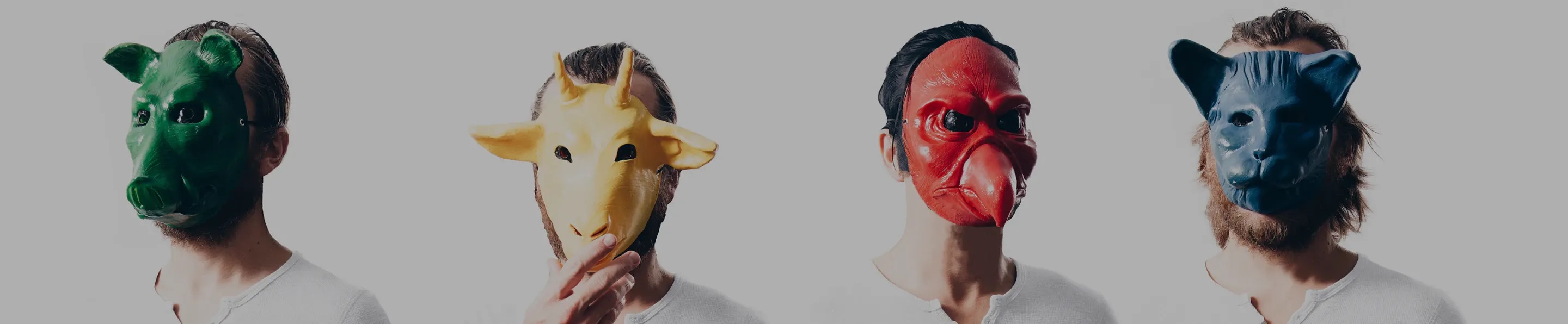 Image of four men wearing animal masks on a white background. 