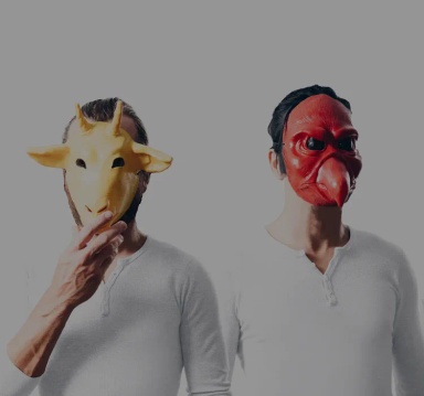 Image of two men wearing animal masks on a white background. 