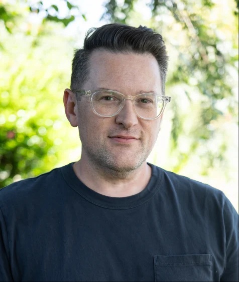 Man wearing glasses and grey shirt. Portrait of a man wearing glasses and grey shirt.