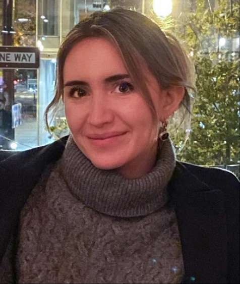 Woman with a gray turtleneck sweater and black jacket. Woman with a gray turtleneck sweater and black jacket.