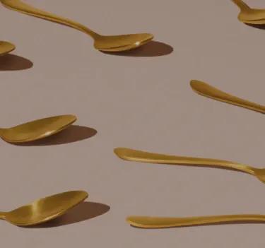 Various golden spoons