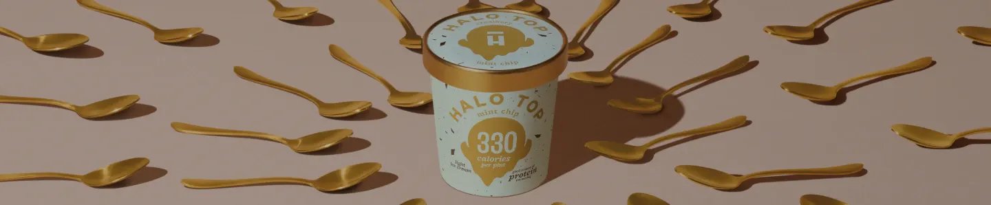Halo Top Pint surrounded by golden spoons.